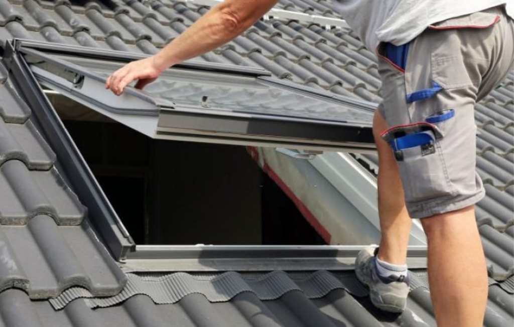 Skylight being installed on a house.